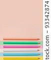 Multicolored pencils lined up on a multicolored background. 93342874