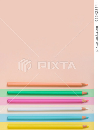 Multicolored pencils lined up on a multicolored background. Multicolored pencils lined up on a multicolored background. 93342874