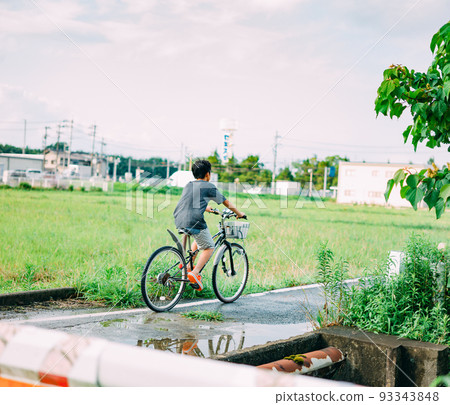 boy riding a bicycle 93343848
