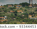 View of houses with red roofs on a hill, Slovenia 93344453