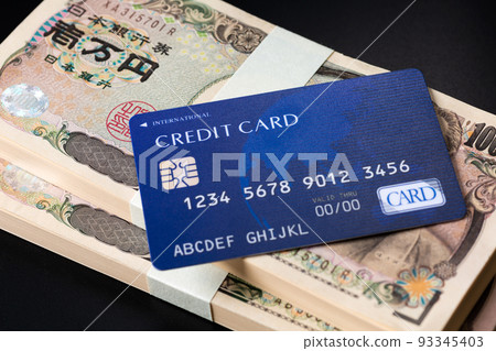 Bills and credit cards black background 93345403