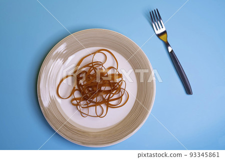 Rubber bands on a dish 93345861