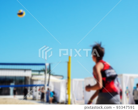 Beach volleyball game. Playing beach volleyball on the sea coast. Blurred image 93347591