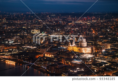 Aerial view of north east part of London, in evening. St Pauls Cathedral visible over river Thames Aerial view of north east part of London, in evening. St Pauls Cathedral visible over river Thames 93348185