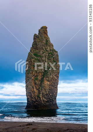 seascape of Kunashir, ocean shore with a huge vertical rock in the water seascape of Kunashir, ocean shore with a huge vertical rock in the water 93348186