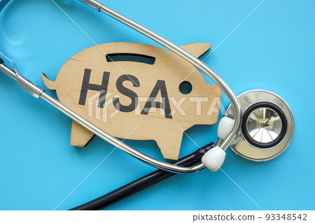 Piggy bank with sign HSA Health Savings Account and stethoscope. Piggy bank with sign HSA Health Savings Account and stethoscope. 93348542