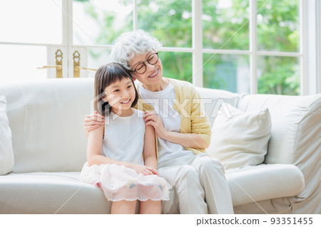 grandchildren and grandma spending time in the living room grandchildren and grandma spending time in the living room 93351455