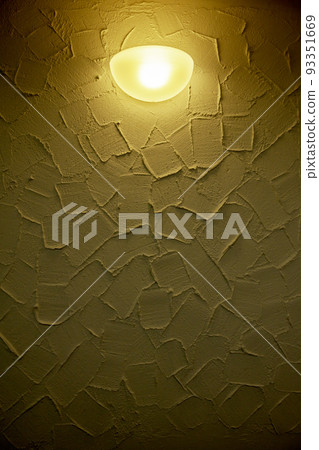 yellow lamp on western stucco 93351669