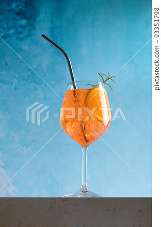 Aperol spritz cocktail in glass with ice and slice