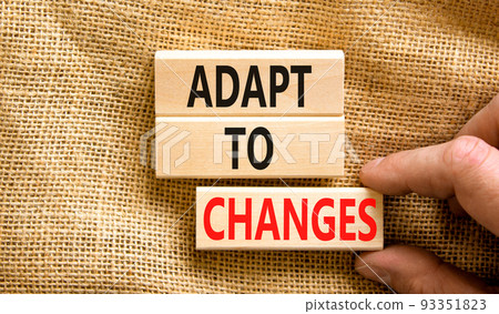Adapt to changes symbol. Concept words Adapt to changes on wooden blocks. Businessman hand. Beautiful canvas table canvas background. Business and Adapt to changes quote concept. Copy space. Adapt to changes symbol. Concept words Adapt to changes on wooden blocks. Businessman hand. Beautiful canvas table canvas background. Business and Adapt to changes quote concept. Copy space. 93351823