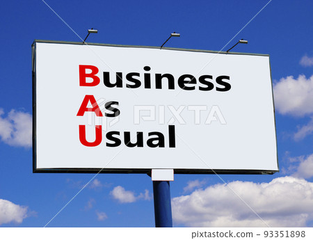 BAU business as usual symbol. Concept words BAU business as usual on white billboard against blue sky and clouds. Beautiful background. Business and BAU business as usual concept. Copy space. 93351898