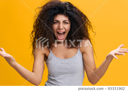 COOL OFFER. Irritated emotional pretty Latin female with afro scream to camera, hold hands up, gesture Bid Fail, stay isolated over yellow background. Conflict concept. Copy space, free place COOL OFFER. Irritated emotional pretty Latin female with afro scream to camera, hold hands up, gesture Bid Fail, stay isolated over yellow background. Conflict concept. Copy space, free place 93351902