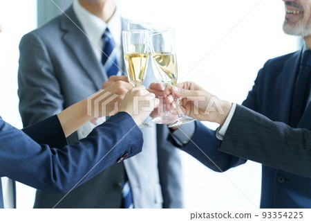 Business person toasting with sparkling wine 93354225