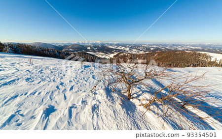Wonderful wintery Scenery in sunny day. Winter landscape with snow capped mountain under sunlight. Popular hiking and travel place. Winter wonderland. stunning nature background. Carpathian mountains. Wonderful wintery Scenery in sunny day. Winter landscape with snow capped mountain under sunlight. Popular hiking and travel place. Winter wonderland. stunning nature background. Carpathian mountains. 93354501