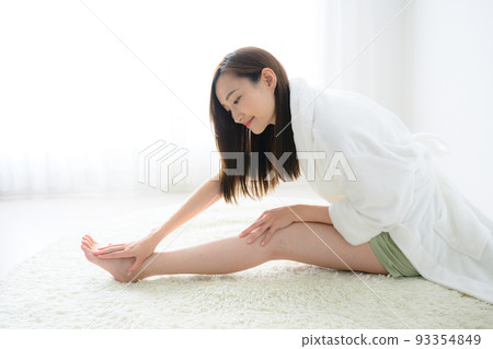 woman stretching her legs woman stretching her legs 93354849