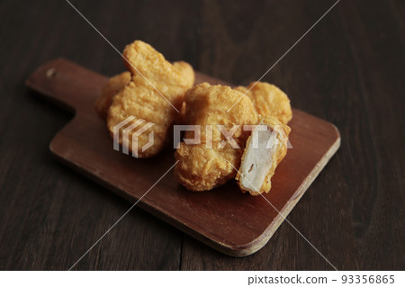 Nuggets like fried chicken with junk food and fast food with mild drugs on the table 93356865