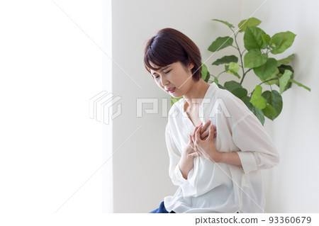 A woman with a sore chest A woman with a sore chest 93360679