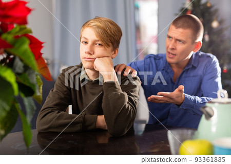 Man scolding his son before Xmas 93361885
