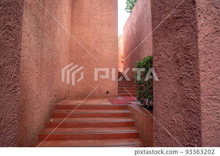 beautiful red unique walkway wall with abstract texture all around. 93363202