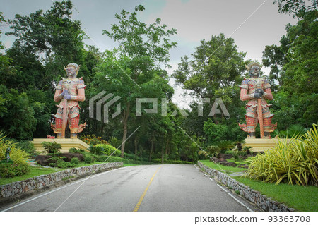 Two Giants the demon statue in front of walkway to Phra Mahathat Chedi Phakdee Prakat. Two Giants the demon statue in front of walkway to Phra Mahathat Chedi Phakdee Prakat. 93363708