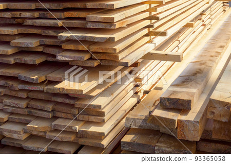 Wooden boards are stacked in a sawmill or carpentry shop. Sawing drying and marketing of wood Wooden boards are stacked in a sawmill or carpentry shop. Sawing drying and marketing of wood 93365058