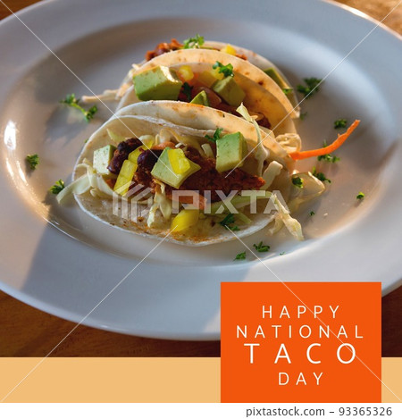Composition of happy national taco day text with tacos on table Composition of happy national taco day text with tacos on table 93365326