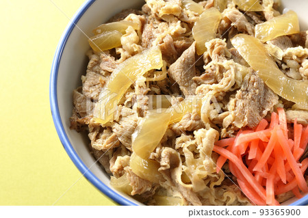 A bird's-eye view of a simple gyudon topped with red pickled ginger 93365900