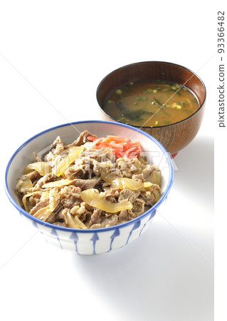 A simple beef bowl with red pickled ginger and miso soup shot against a white background A simple beef bowl with red pickled ginger and miso soup shot against a white background 93366482