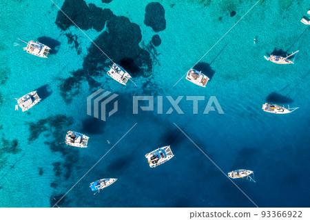 Yachts near the green island in Greece. Luxury vacation at sea 93366922