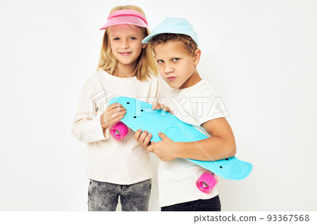 Modern teenagers posing together active rest entertainment light background Modern teenagers posing together active rest entertainment light background 93367568