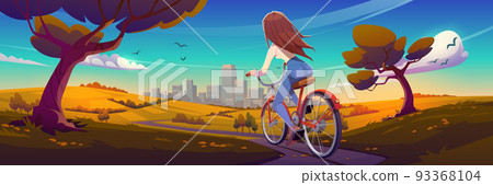 Girl rides on bike on road to city in fall 93368104