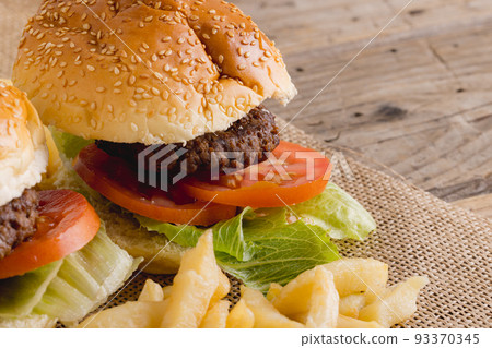Close-up of burger and french fries, copy space 93370345