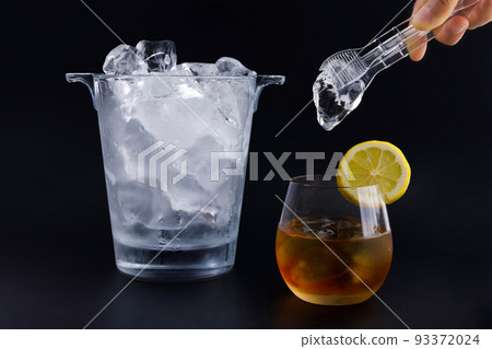 creative summer photo of ice and stainless ice, black background 93372024