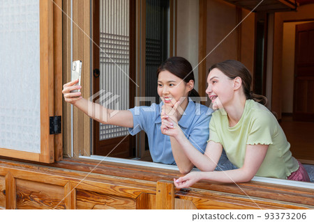 Experience Hanok, Korean traditional house_Korean and Caucasian girls taking a selfie Experience Hanok, Korean traditional house_Korean and Caucasian girls taking a selfie 93373206