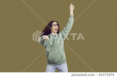 Funny happy cheerful student girl in casual clothes and glasses dancing gangnam style 93375974