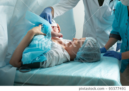 Mother look to her newborn baby in hospital Mother look to her newborn baby in hospital 93377491