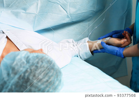 Female patient in operating room at hospital, ready to cesarean section Female patient in operating room at hospital, ready to cesarean section 93377508