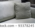 Close-up of grey cushion on cozy sofa. Pillow on a casual couch in living room 93378245