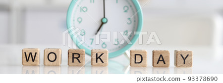 Text working day and alarm clock on table Text working day and alarm clock on table 93378690