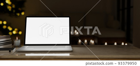 Workspace tabletop with laptop mockup and copy space over the dark office in the background Workspace tabletop with laptop mockup and copy space over the dark office in the background 93379950