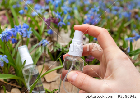 Hand spray from clear pump bottle in blue flowers 93380942