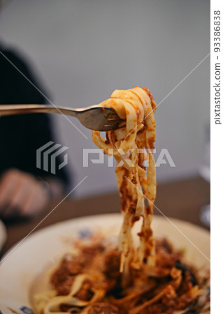 woman hand holding pasta woman hand holding pasta 93386838