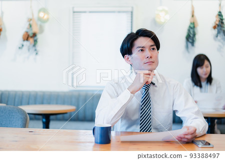 businessman working in a cafe businessman working in a cafe 93388497