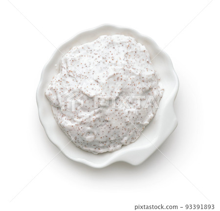 Top view of exfoliating body scrub in white ceramic cup Top view of exfoliating body scrub in white ceramic cup 93391893