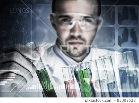 Portrait of concentrated male scientist working with reagents in laboratory Portrait of concentrated male scientist working with reagents in laboratory 93392528