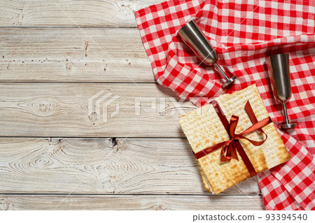 Jewish holiday Passover banner design with wine, matzo on wooden background. 93394540