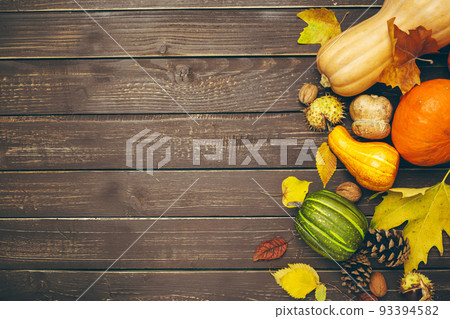 Pumpkin on old rustic wooden table. 93394582