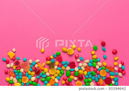 Colorful lollipops on a pink background Colorful lollipops on a pink background 93394642