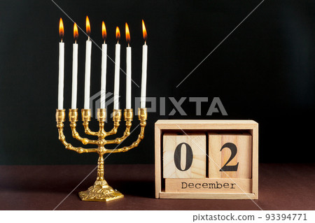 Bronze Hanukkah menorah with burning candles Bronze Hanukkah menorah with burning candles 93394771