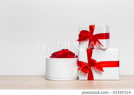 Christmas gift box on tablet Christmas gift box on tablet 93395524